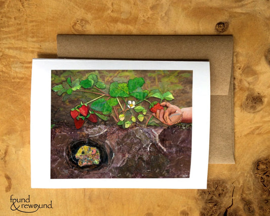 Greeting Card of a Paper Collage of a child's hand picking a strawberry with a vole under the soil - Blank Inside