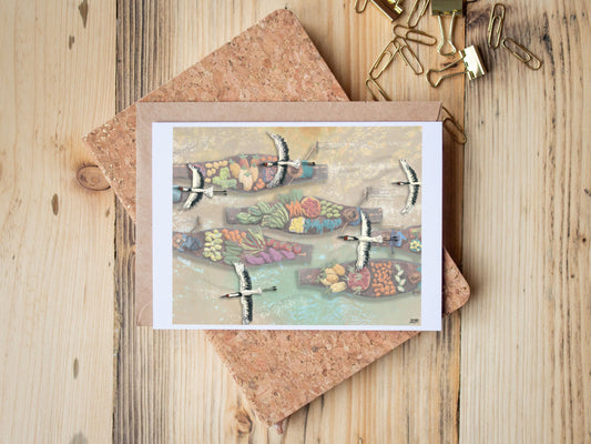 Greeting Card of mixed media collage of Red-Crowned Cranes flying over market boats loaded with vegetables and fruit - Blank Inside