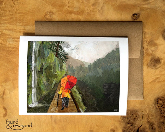 Greeting Card of a Paper Collage of a Person Hiking in the Rain with and Umbrella in the Columbia River Gorge - Blank Inside