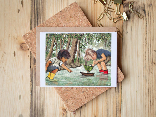 Greeting Card of mixed media collage of two children in a stream playing with a nature boat together, forest, water - Blank Inside