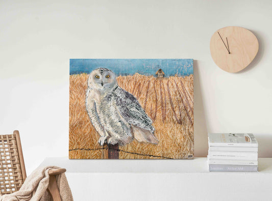 20"x16"x 1.5" Wrapped Canvas Printof a mixed media collage of a Snowy Owl perched on a fence post with birdwatcher in background