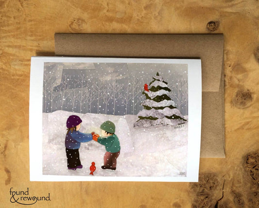 Holiday Greeting Card of Children in the Snow, Red Birds, and Holiday Magic